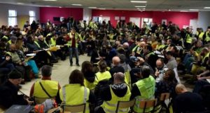 mass meeting of workers in hi-viz jackets