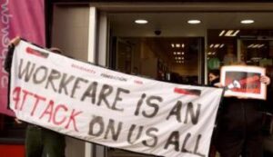 community picket with banner "Workfare is an attack on us all"